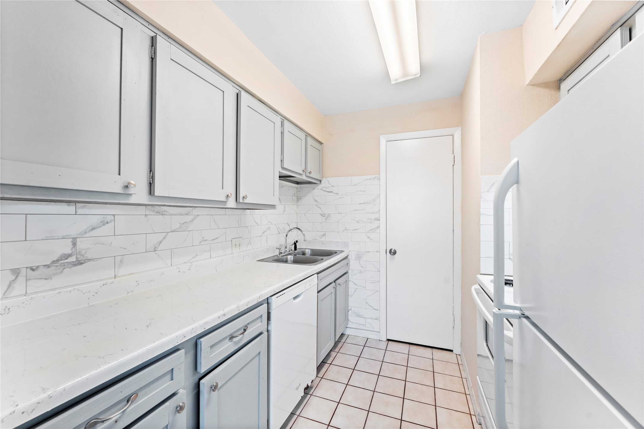 3316 Burke Road, Unit 43 Pasadena, TX 77504 - Photo 9 of 15 a kitchen with a sink and cabinets