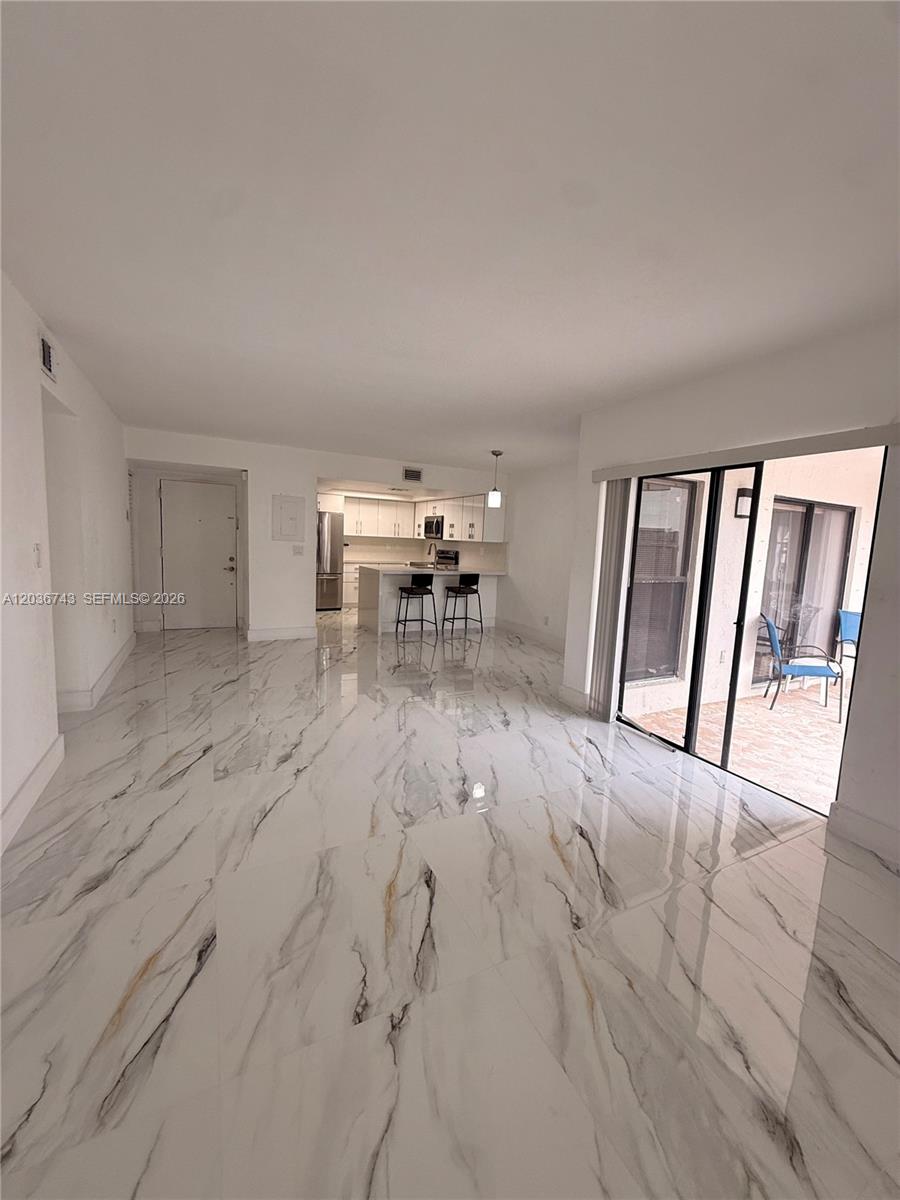 10875 Northwest 7th Street, Unit 1136 Miami, FL 33172 - Photo 8 of 25 a view of a livingroom with furniture and window