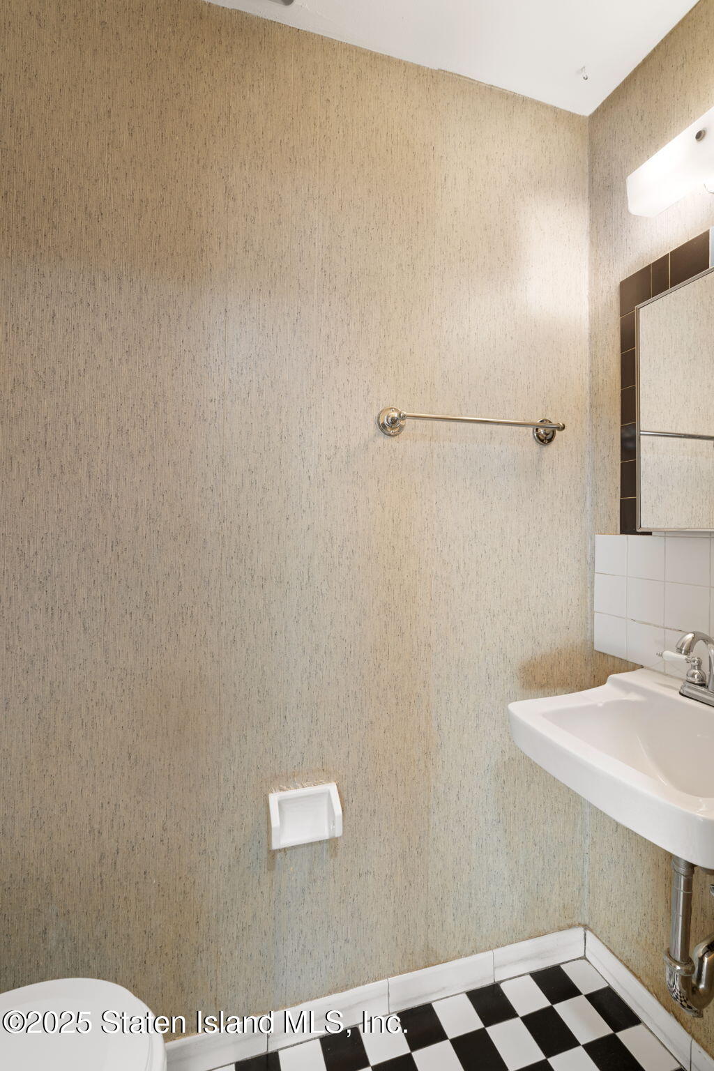 8 Dreyer Avenue, Unit A Staten Island, NY 10314 - Photo 13 of 23 a bathroom with a sink a toilet and mirror