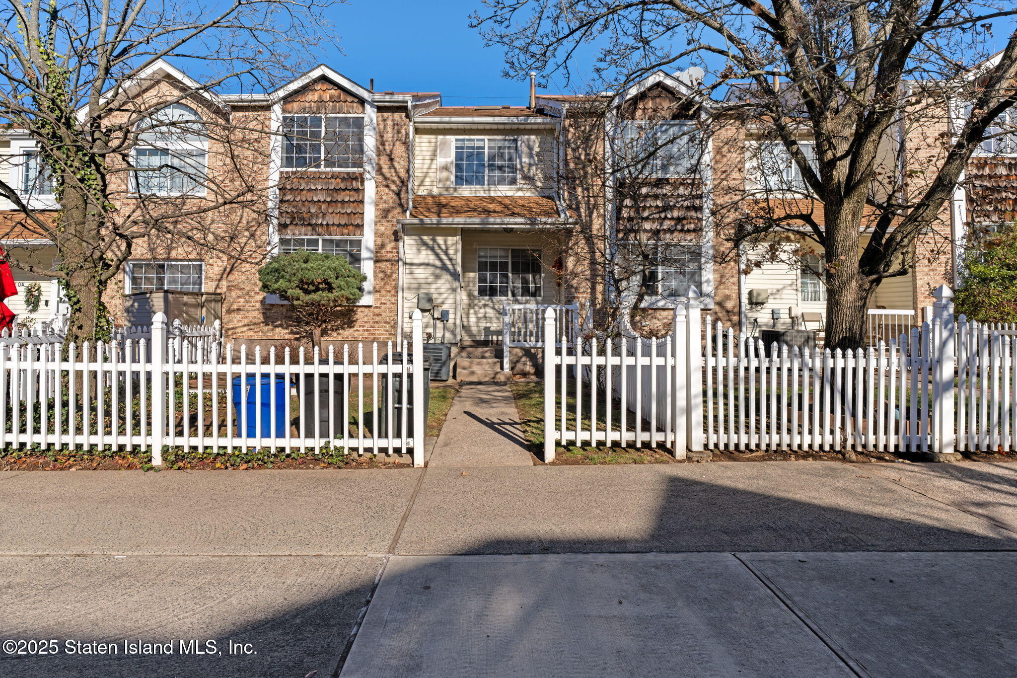 8 Dreyer Avenue, Unit A Staten Island, NY 10314 - Photo 2 of 23 a view of a brick house with iron fence