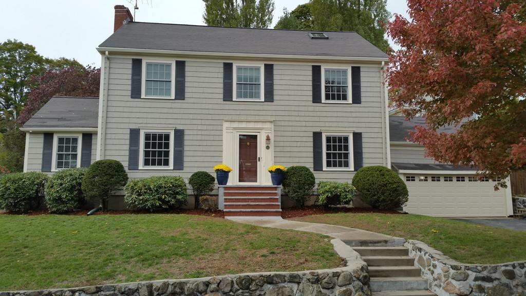 a front view of a house with a yard