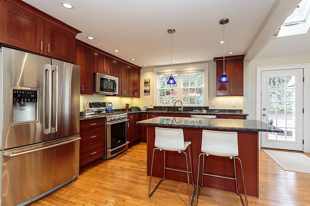 166 Lewis Road Belmont, MA 02478 - Photo 12 of 30 a kitchen with granite countertop a refrigerator stove top oven and sink