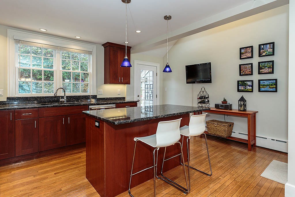 166 Lewis Road Belmont, MA 02478 - Photo 13 of 30 a kitchen with granite countertop a sink cabinets and window
