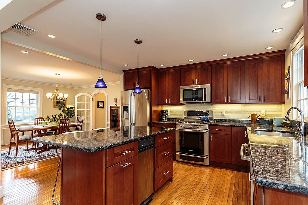 166 Lewis Road Belmont, MA 02478 - Photo 15 of 30 a kitchen with lots of counter top space space a sink and appliances