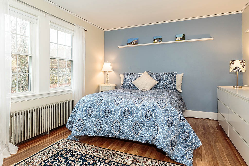 166 Lewis Road Belmont, MA 02478 - Photo 22 of 30 a bedroom with a bed and a window