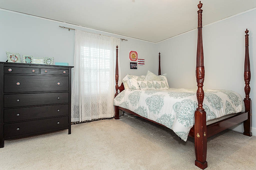 166 Lewis Road Belmont, MA 02478 - Photo 23 of 30 a bedroom with a bed and a window