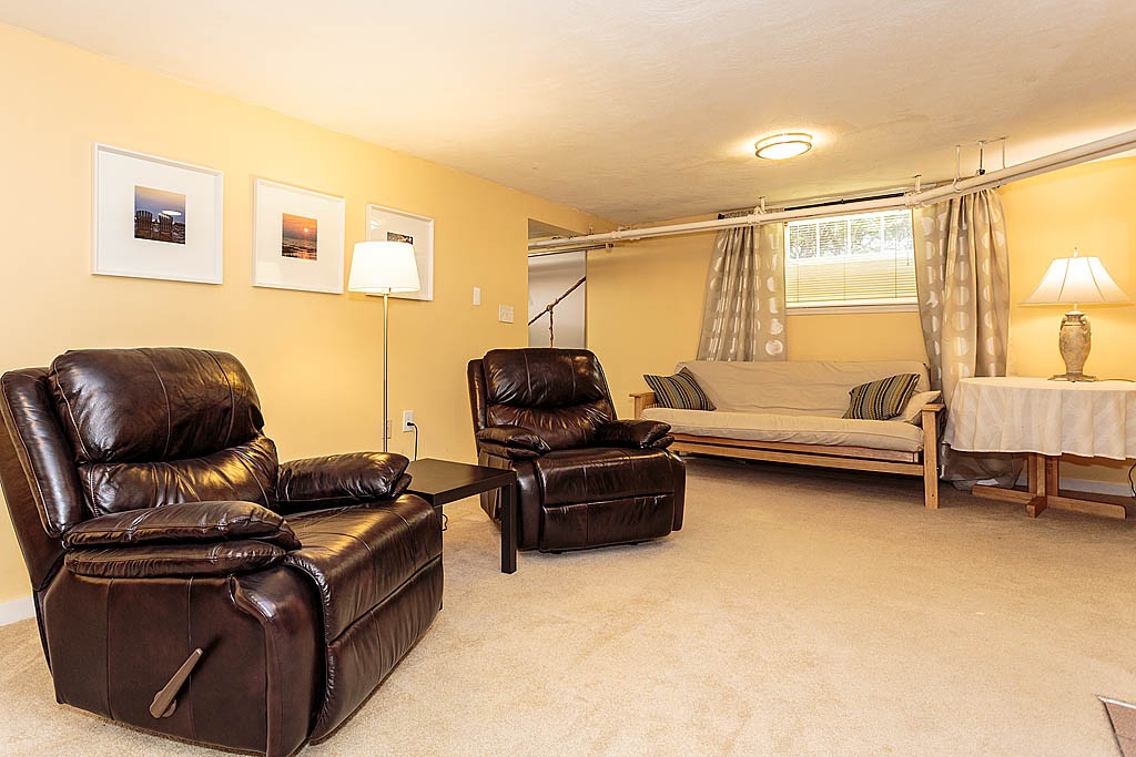 166 Lewis Road Belmont, MA 02478 - Photo 28 of 30 a living room with furniture and a window