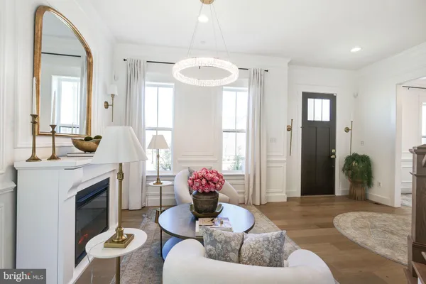 a view of a kitchen center island and living room view