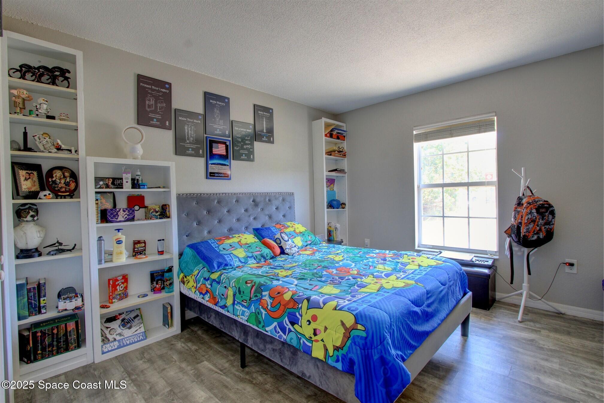 4850 Ancona Road Cocoa, FL 32927 - Photo 16 of 31 a bedroom with a bed and a window