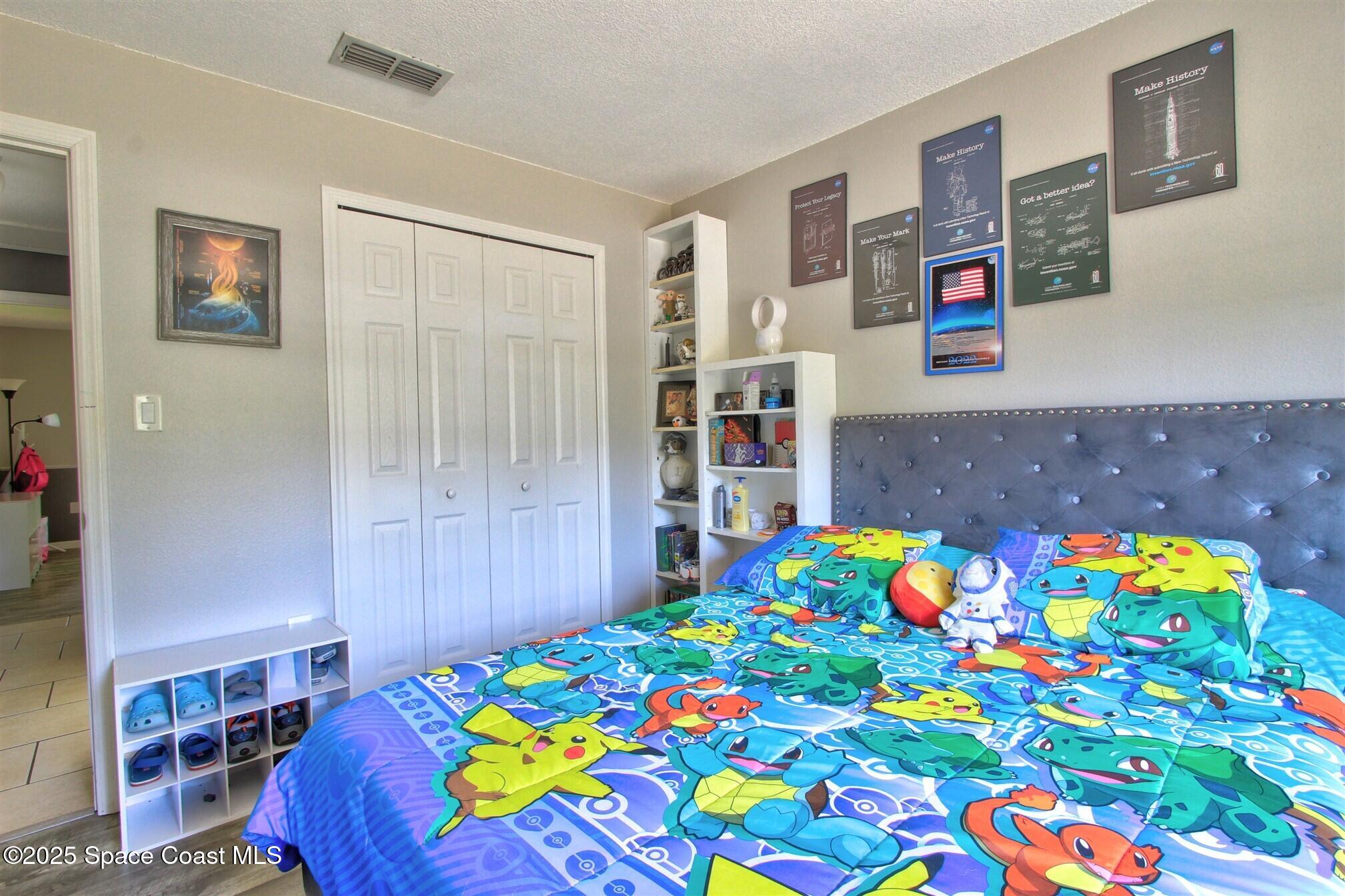 4850 Ancona Road Cocoa, FL 32927 - Photo 17 of 31 a room that has a bunch of books on it