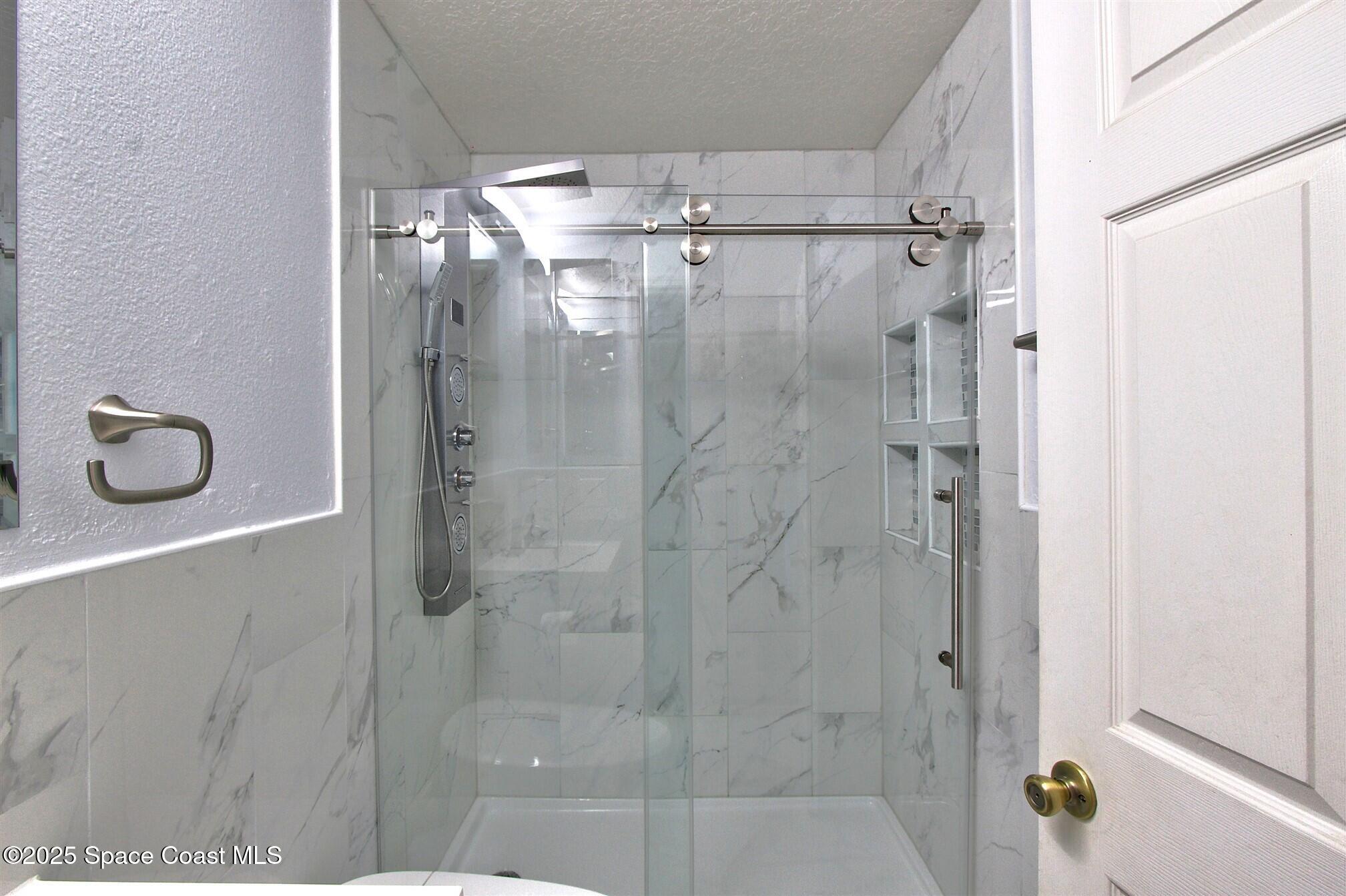 4850 Ancona Road Cocoa, FL 32927 - Photo 19 of 31 a bathroom with a shower