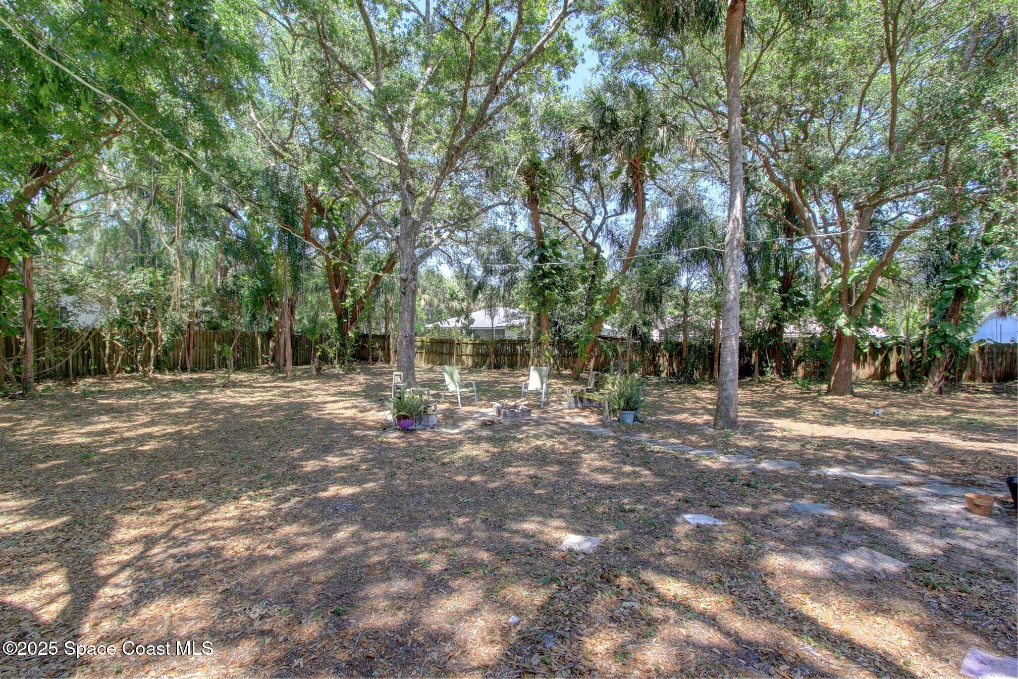 4850 Ancona Road Cocoa, FL 32927 - Photo 26 of 31 a view of a trees with yard