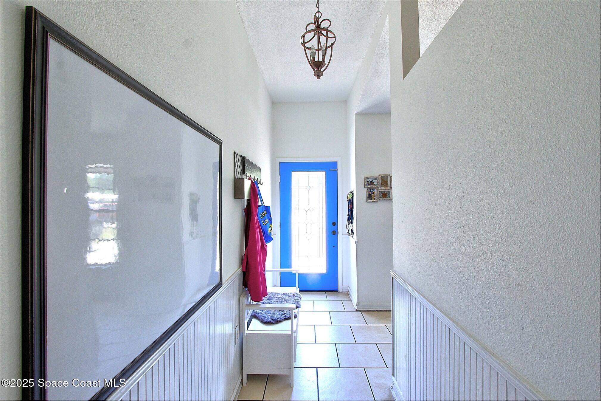 4850 Ancona Road Cocoa, FL 32927 - Photo 6 of 31 a view of an entryway with wooden floor