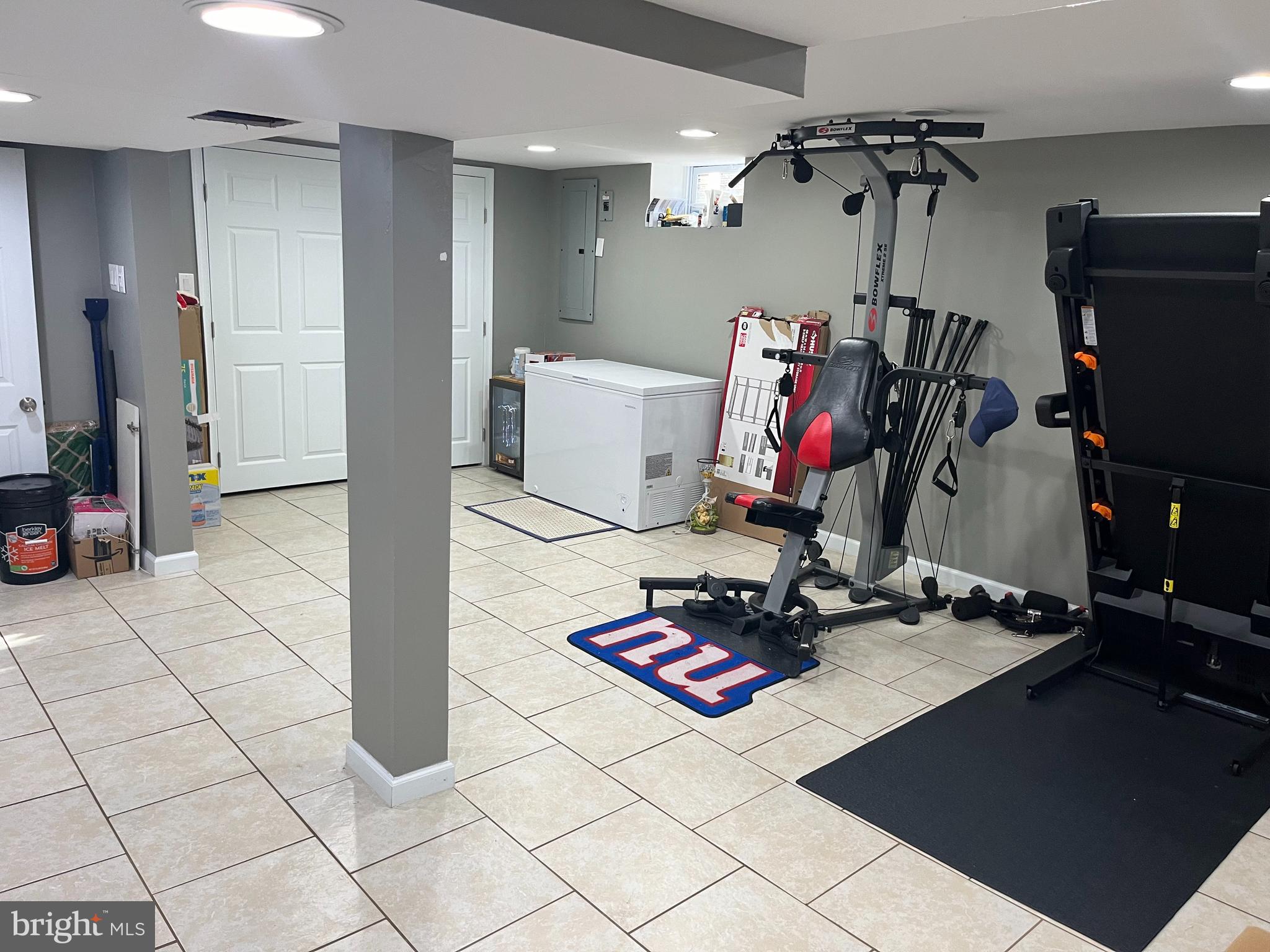 1006 Susan Road Philadelphia, PA 19115 - Photo 36 of 37 a room with gym equipment and white walls