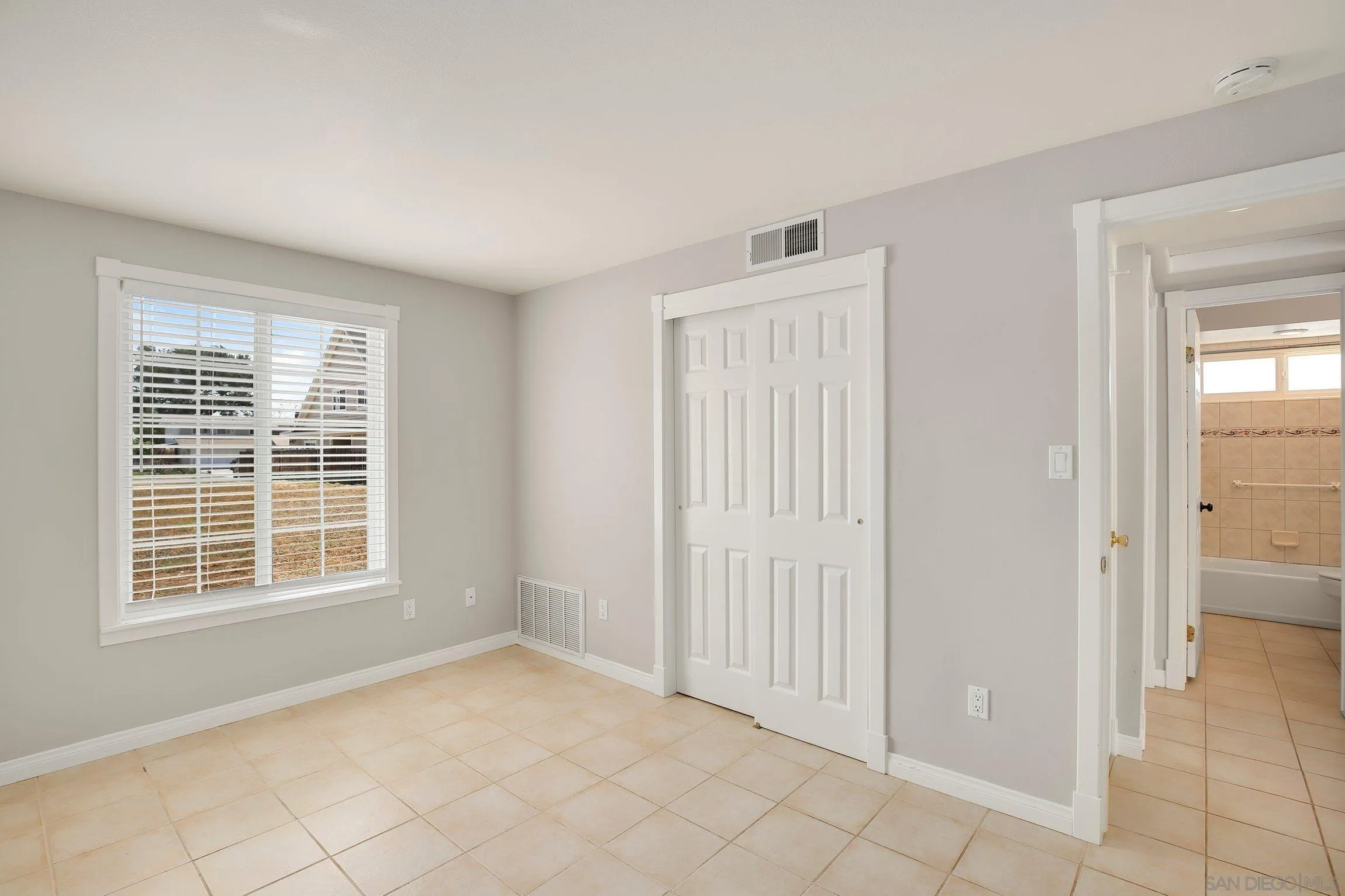13647 Somerset Road Poway, CA 92064 - Photo 12 of 25 a view of an empty room with a window