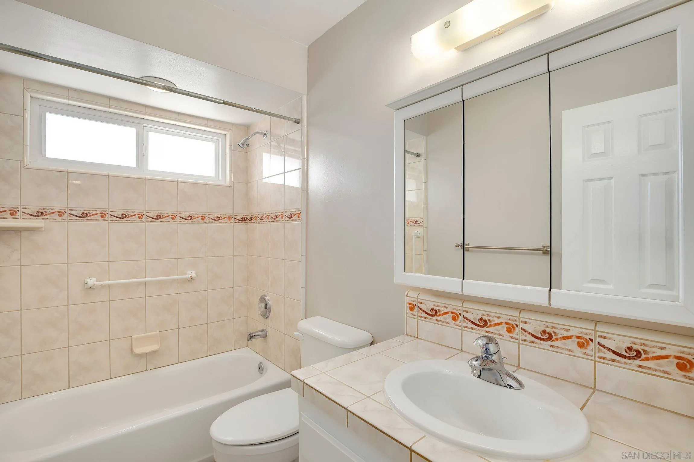 13647 Somerset Road Poway, CA 92064 - Photo 13 of 25 a bathroom with a sink toilet and shower