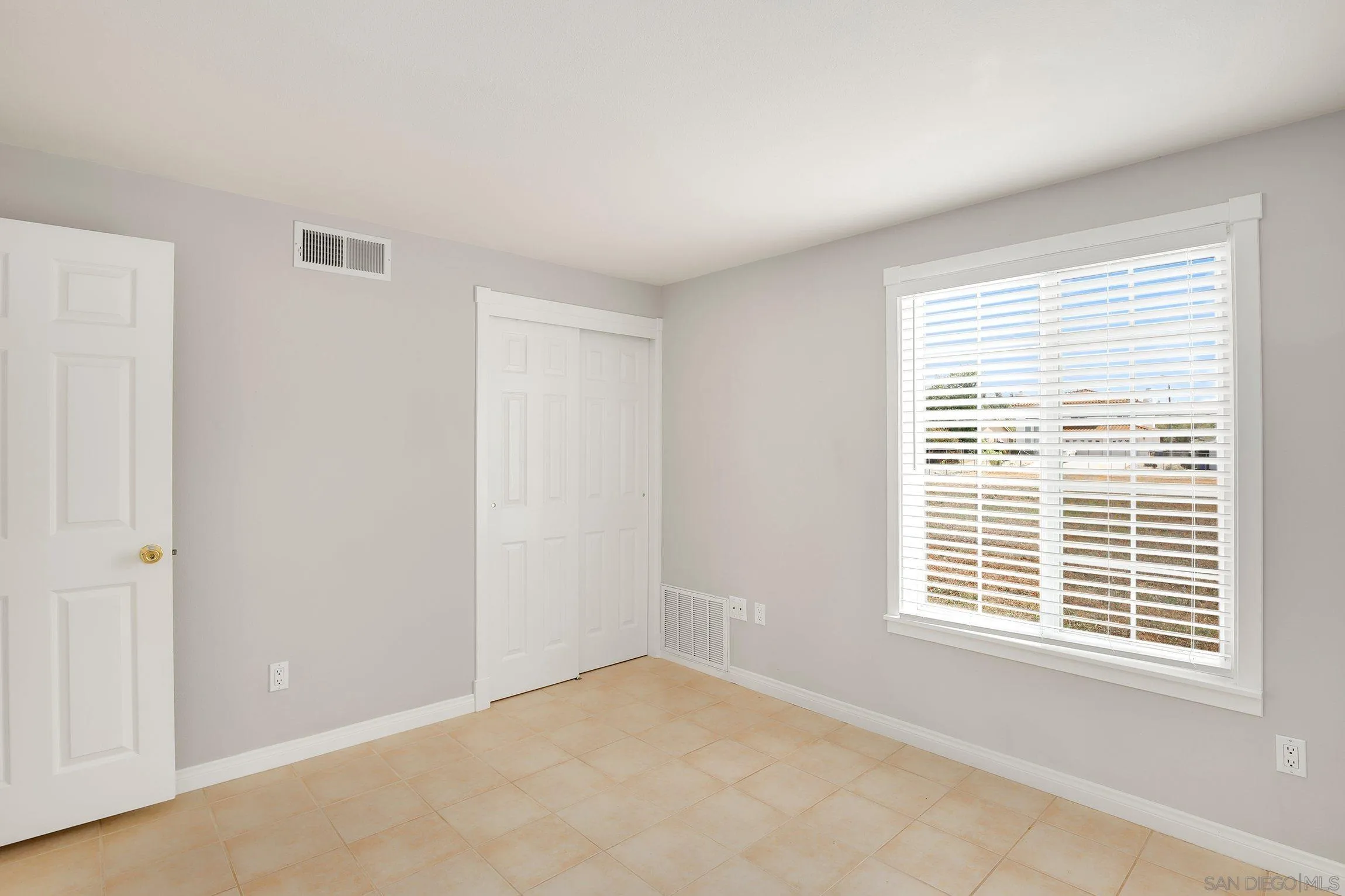 13647 Somerset Road Poway, CA 92064 - Photo 15 of 25 a view of an empty room with a window