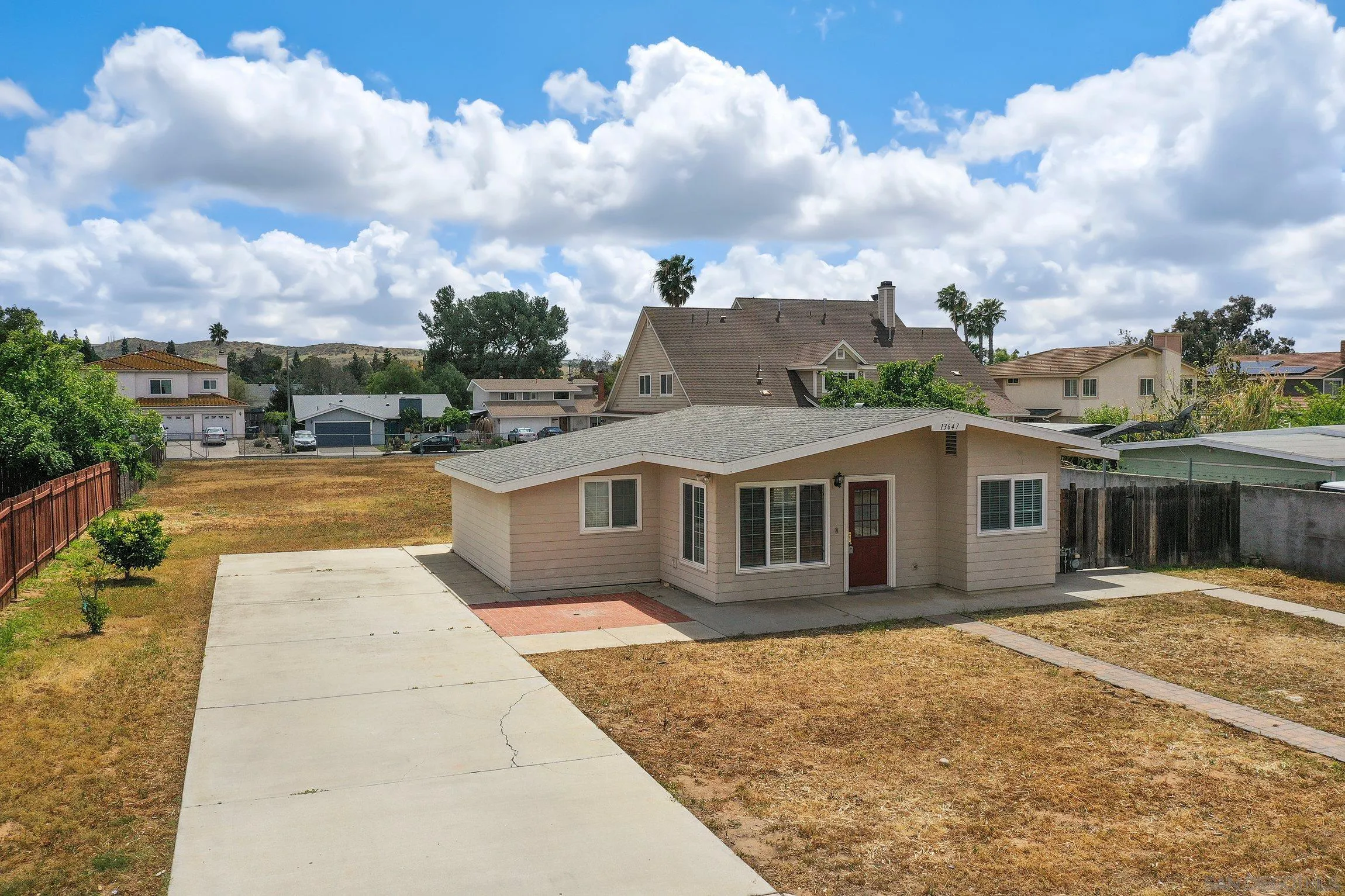 13647 Somerset Road Poway, CA 92064 - Photo 2 of 25 a view of a house with a backyard