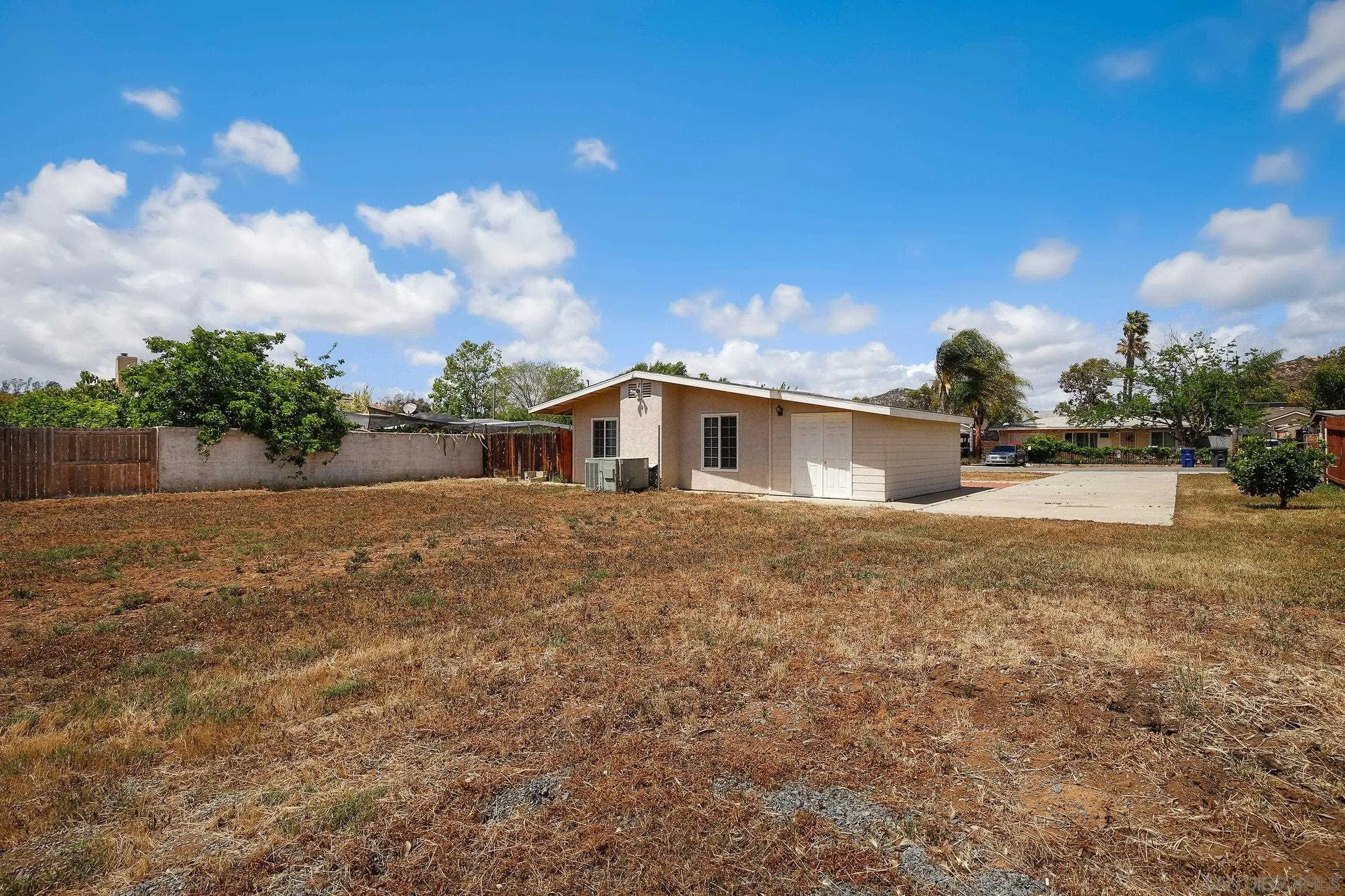 13647 Somerset Road Poway, CA 92064 - Photo 24 of 25 a front view of a house with a yard