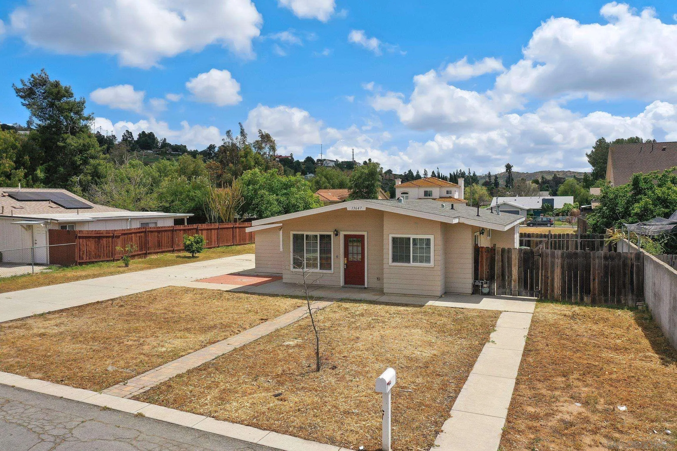 13647 Somerset Road Poway, CA 92064 - Photo 3 of 25 a view of a house with a yard