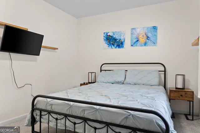 a bedroom with a bed and a closet