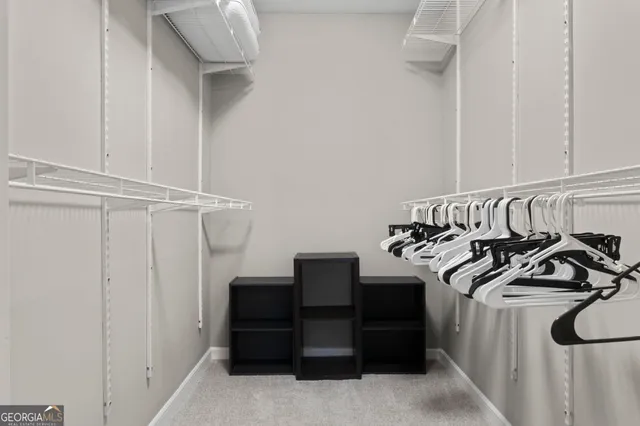 a bedroom with furniture and a wooden floor