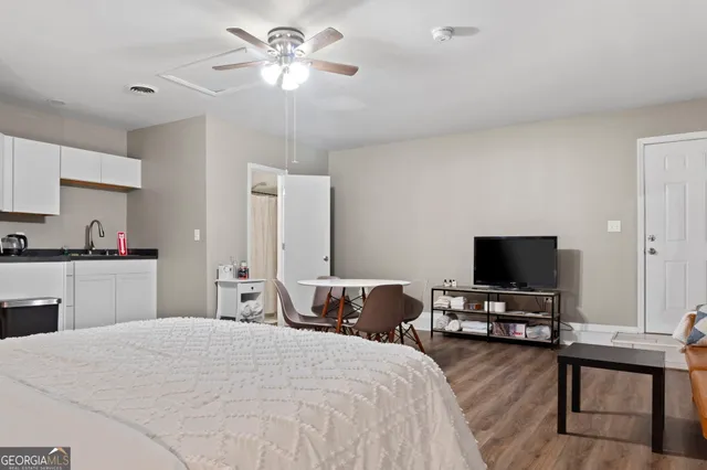 a view of patio with table and chairs and potted plants