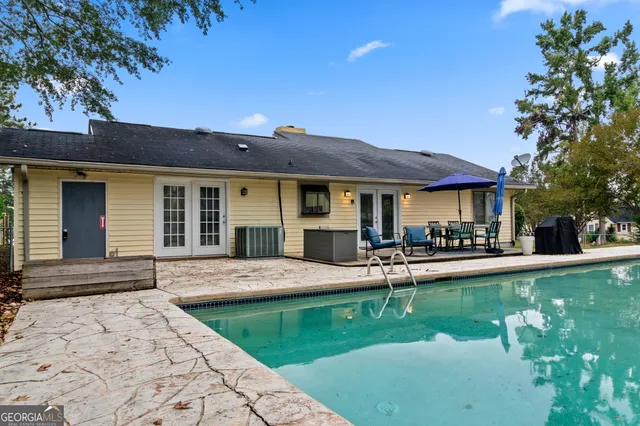 a view of a backyard with sitting area
