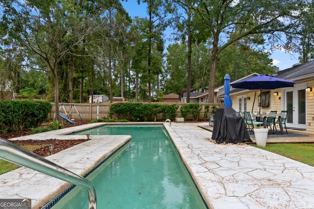 a view of a two chairs in the balcony