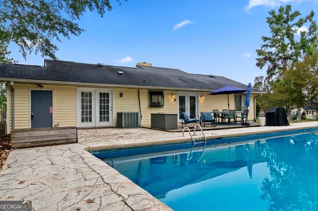 a view of a patio with chairs and a patio