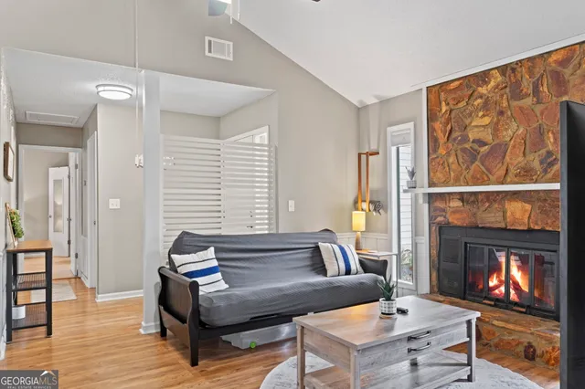 a living room with furniture and a fireplace or television