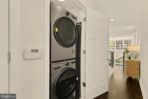 a view of a hallway with washer and dryer