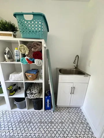 a reading room with furniture and a window