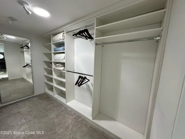 a bedroom with a bed and dresser