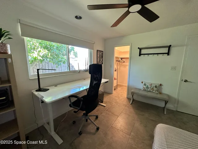 a white toilet sitting next to a small bathroom