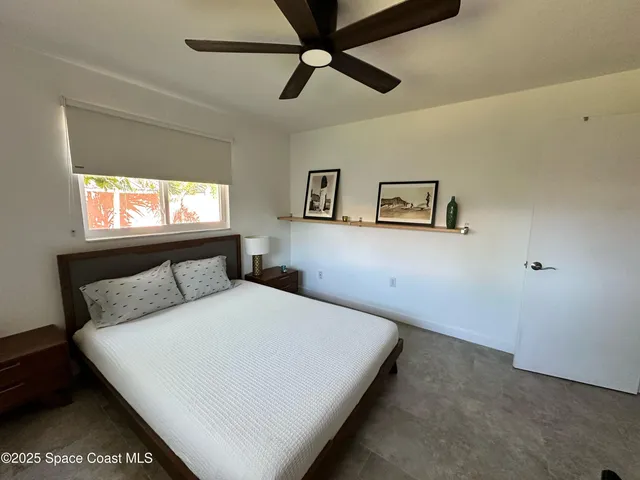 a living room with a couch and a window