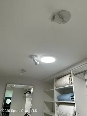 a view of a hallway view with staircase