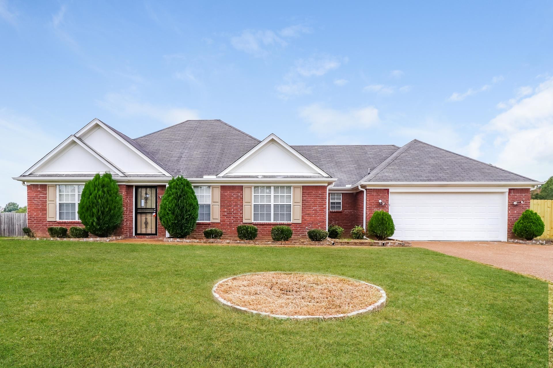2415 North Forest Hill Irene Road Cordova, TN 38016 - Photo 1 of 16 Ranch-style house with a shingled roof, brick siding, driveway, and an attached garage