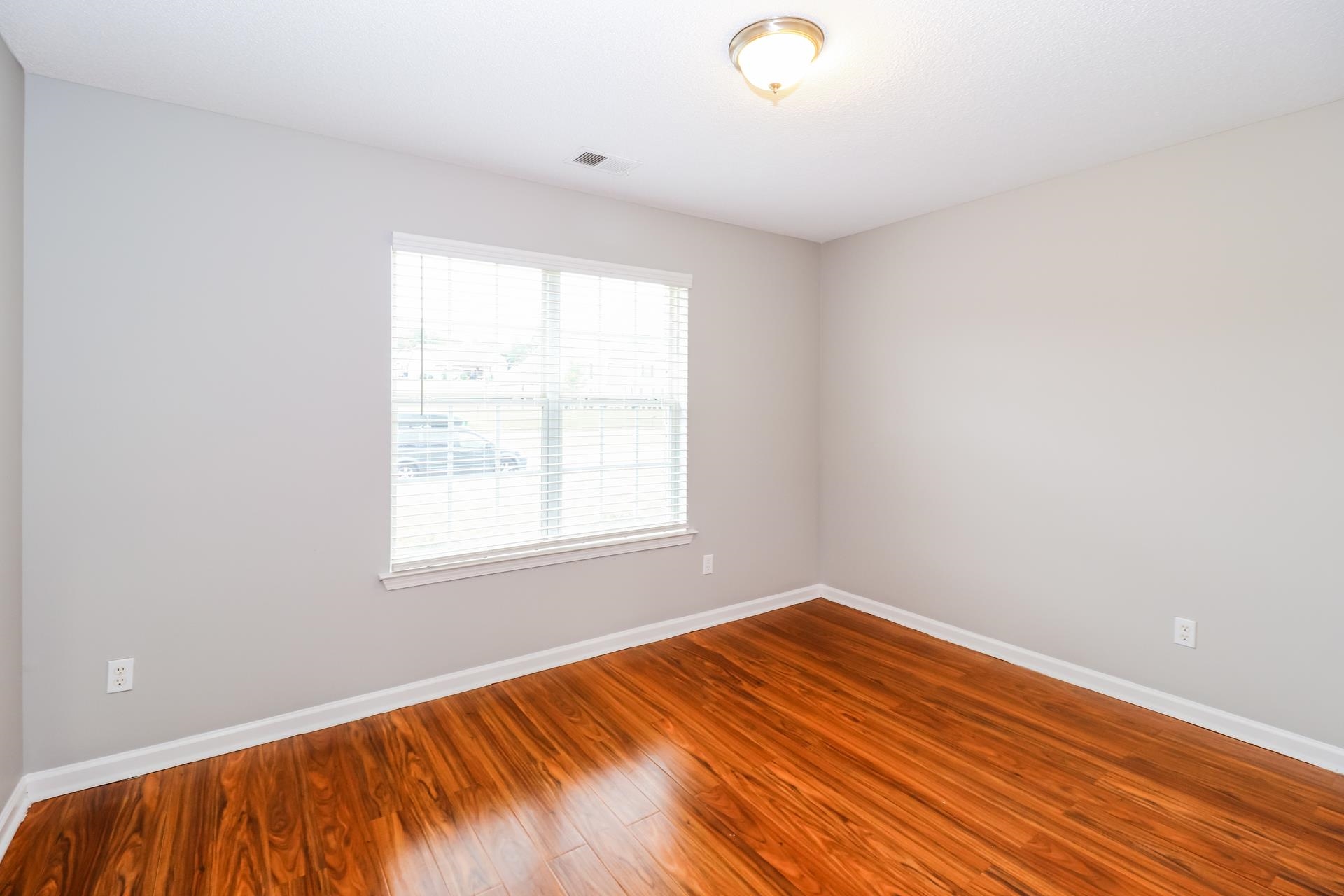 2415 North Forest Hill Irene Road Cordova, TN 38016 - Photo 10 of 16 Spare room featuring baseboards and wood finished floors
