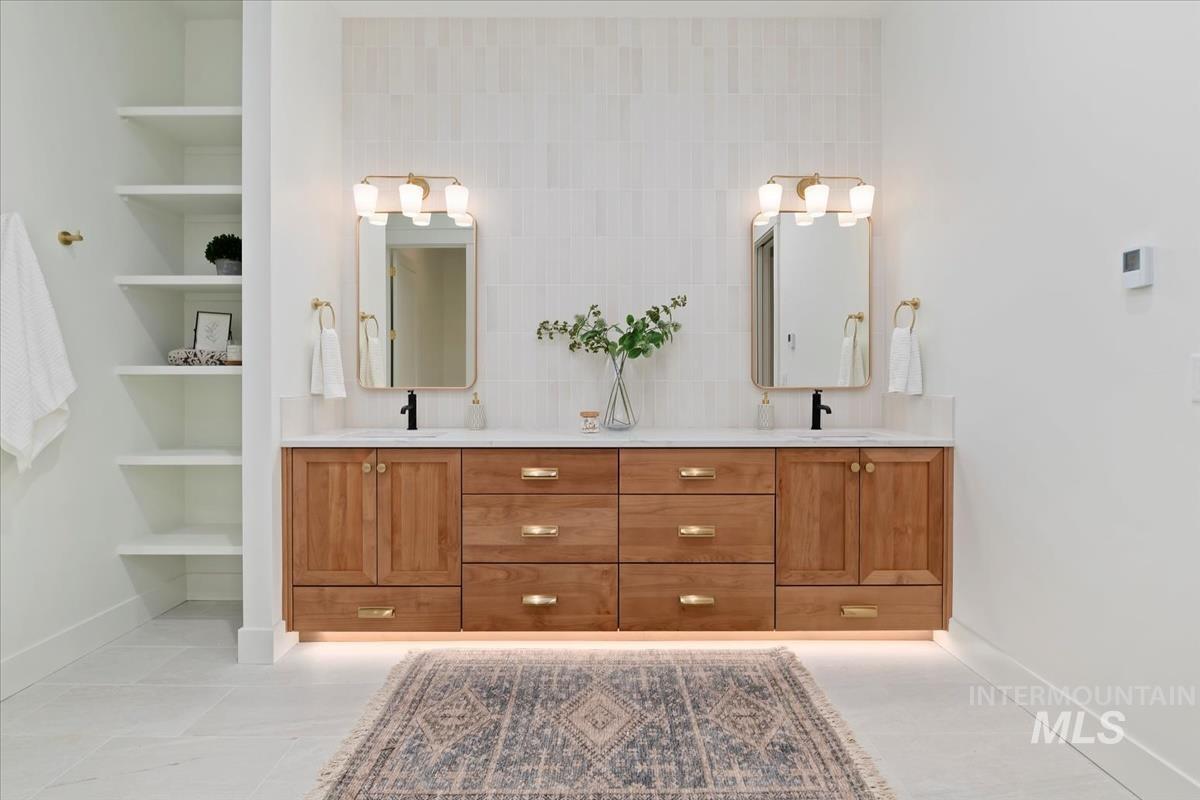 196 North Timber Wolf Place Eagle, ID 83616 - Photo 23 of 50 Bathroom with double vanity and built in shelves