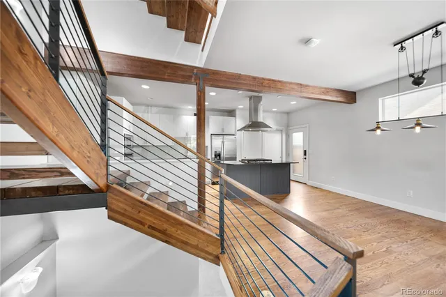 a view of a living room and entryway