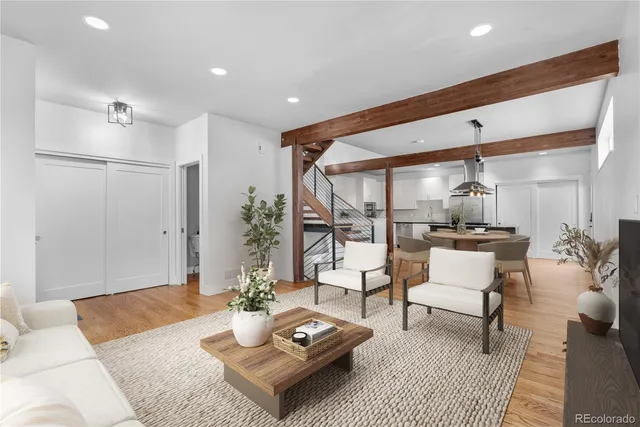 a living room with furniture and a table