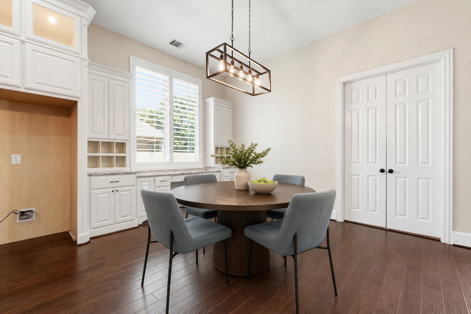 28226 South Firethorne Road Katy, TX 77494 - Photo 12 of 39 Situated adjacent to the kitchen, this cheerful breakfast area features a built-in workspace and offers serene views of the private grounds through custom-shuttered windows. Virtually staged.
