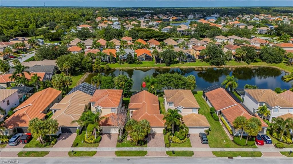 1630 Triangle Palm Terrace Naples, FL 34119 - Photo 24 of 24 an aerial view of residential houses with outdoor space and lake view