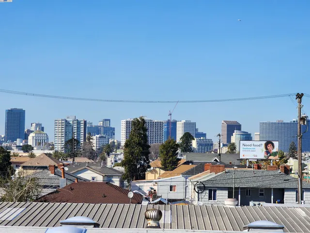a view of a balcony with city view and sitting space