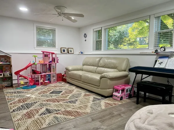 a living room with furniture and a window