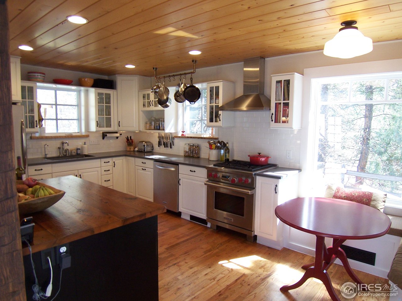 459 Gold Run Road Boulder, CO 80302 - Photo 4 of 18 a kitchen with sink cabinets and wooden floor