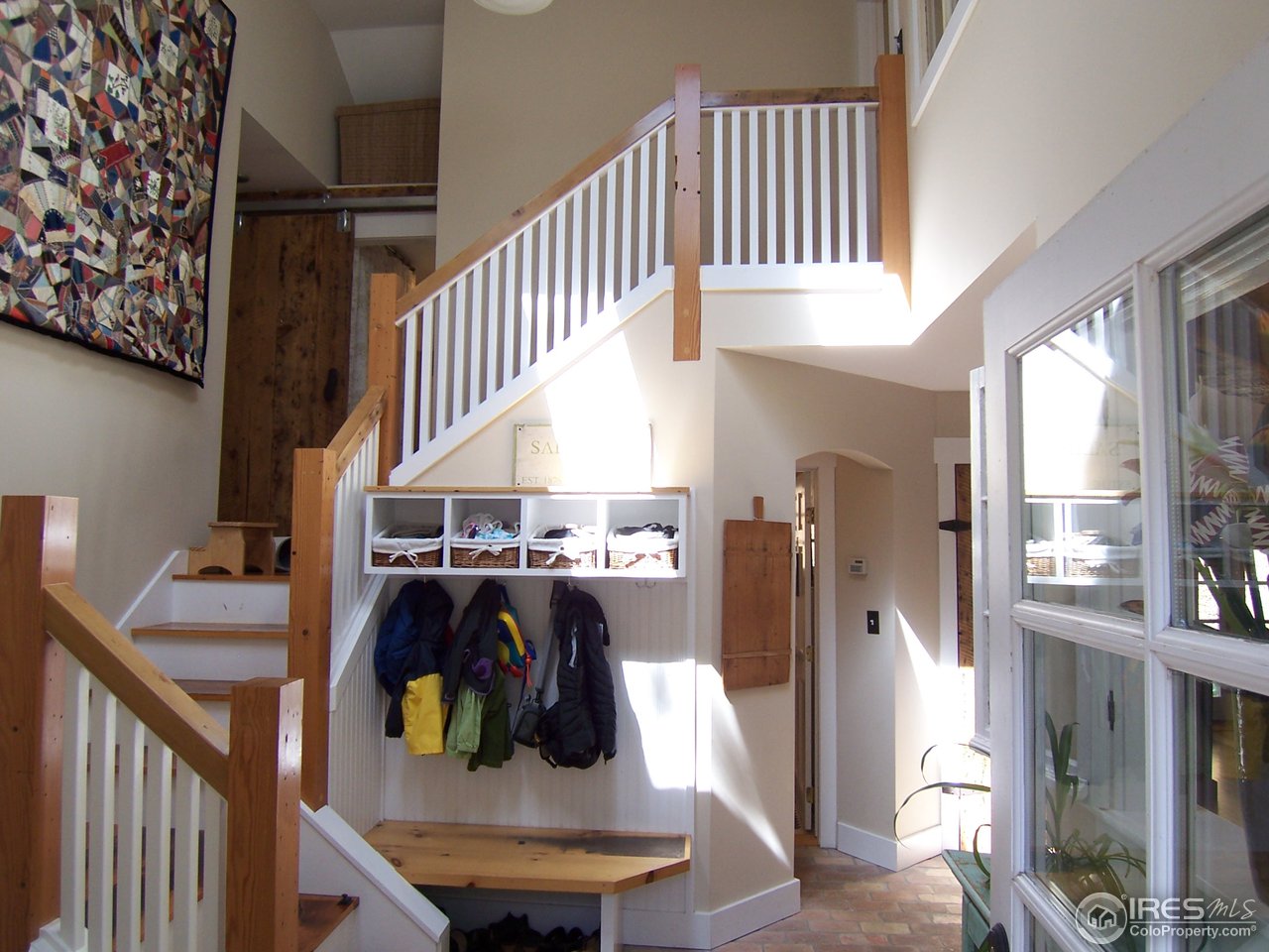 459 Gold Run Road Boulder, CO 80302 - Photo 10 of 18 a view of entryway and hall with wooden floor