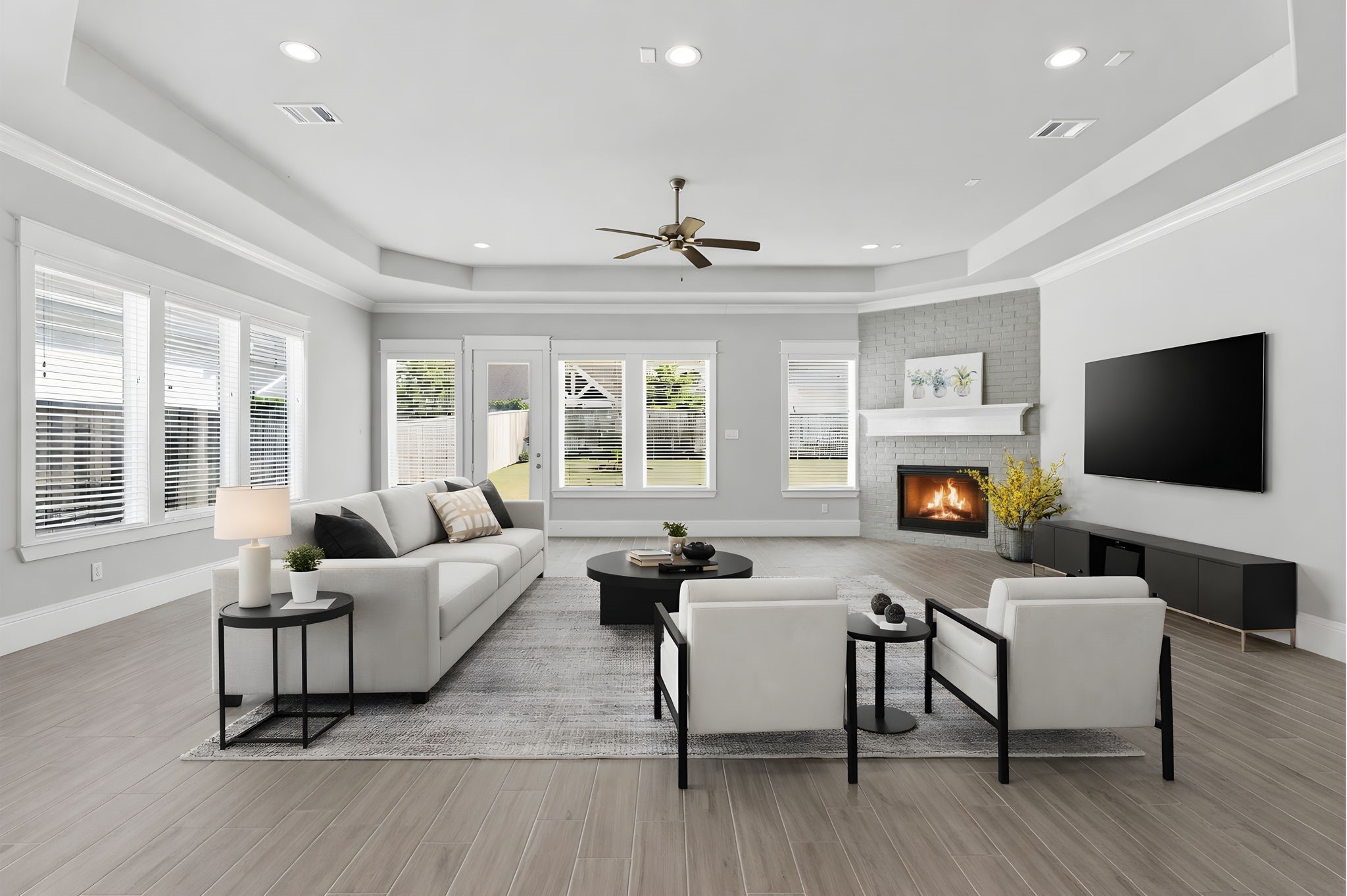 2208 Salt Grass Trail Conroe, TX 77384 - Photo 10 of 34 The large family room space is completely flanked with multiple windows where natural light flows in and brighten the home without the need for lighting if desired.