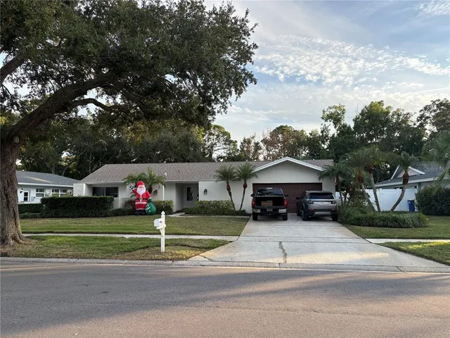 a view of a parked cars in front of a house